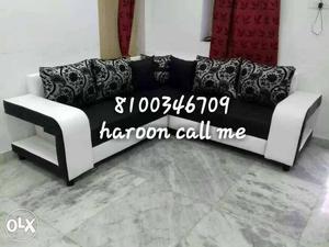 White And Black Leather Based Sectional Sofa With Five Throw