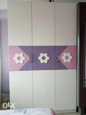 White, Purple And Pink Wooden Closet