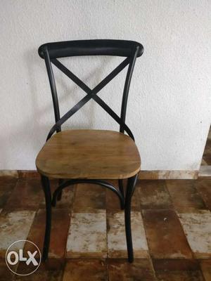 Black Cast Iron chair with wooden base. Standard