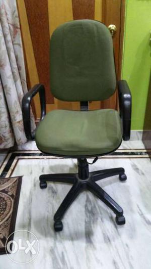 Black Framed Green Fabric Padded Rolling Armchair