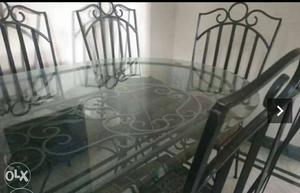 Black Metal Base Oval Top Table With Four Black Metal Chair