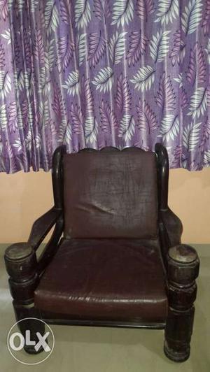 Black Wood-framed Brown Leather Padded Armchair