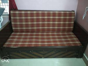 Black Wooden Bed Framed With Red And White Gingham Print