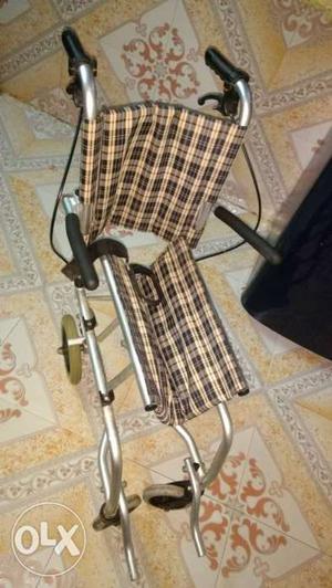 Brown And Black Folding Wheelchair