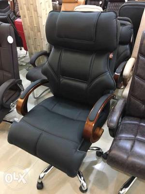 Brown And Black Leather Office Rolling Armchair