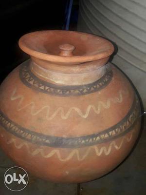 Brown, Black, And Beige Clay Pot