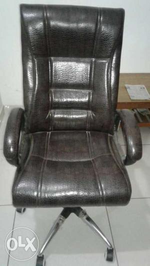 Brown Leather Rolling Armchair