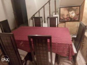 Brown Wooden Dinning Table And Chairs