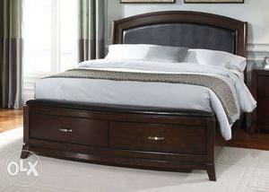 Brown Wooden Platform Bed With White Bedspread
