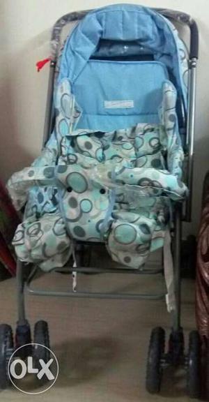 Gray, Blue, And White Stroller