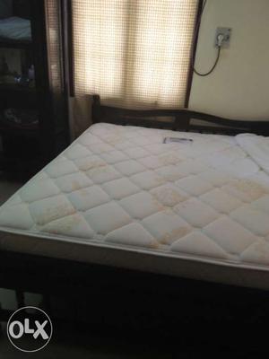 Hardly used mattress for sale along with a fitted