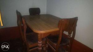 Rectangular Brown Wooden Table And Four Chairs