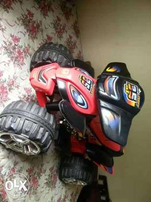 Red And Black All-terrain Vehicle Toy