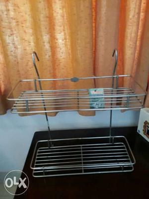 Stainless steel rack in kitchen to keep bottles