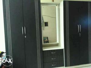 Two Black Wooden Wardrobes