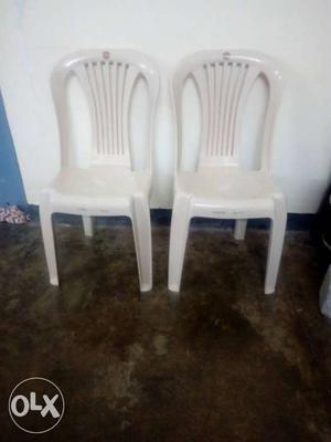 Two White Plastic Chairs