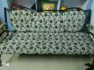 White And Black Floral Couch With Black Steel Frame