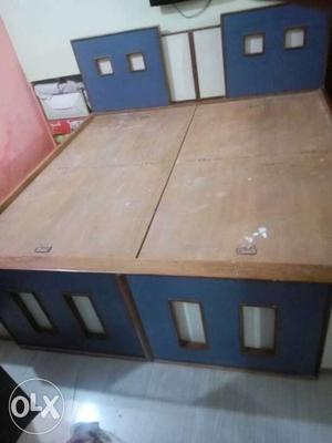 Wooden box bed with side box..
