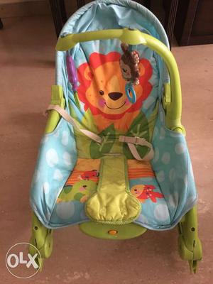 Baby's Blue And Green Fisher-Price Bouncer Seat