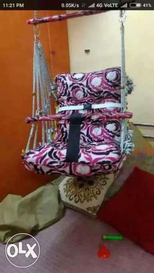 Baby's Pink White And Black Swing Chair