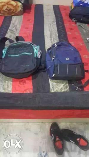 Black-teal And Blue-and-black Backpacks