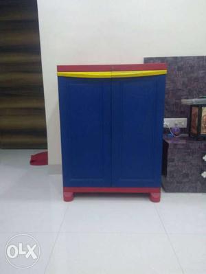 Blue, Yellow, And Red Wooden Cabinet