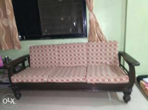 Brown Wooden Framed Pink And White Padded Sofa