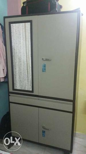 Brown and grey steel Armoire cubord with 7 compartments in a