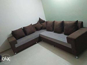 Gray And Brown Sectional Sofa With Throw Pillows