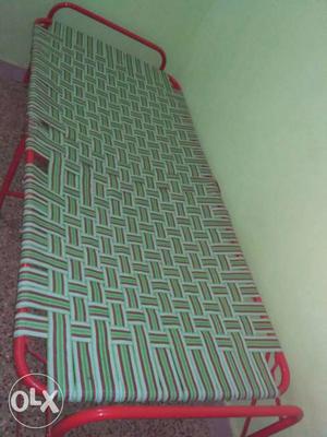 Green And Gray Folding Bed