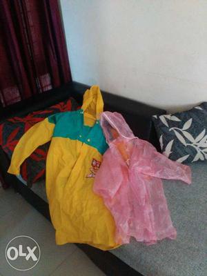 New never used Yellow And Pink Rain Coats - for 4-7 years