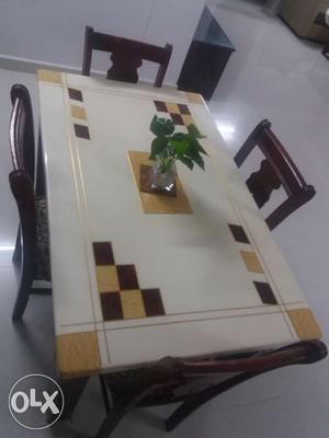 Three year old four chair Marble dining table.