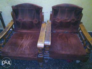 Two Brown Wooden Framed Brown Padded Armchairs
