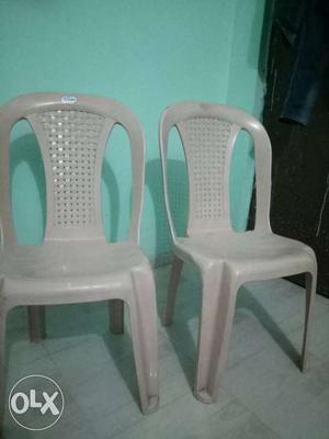 Two plastic chairs