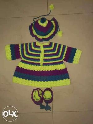 Yellow, Purple, And Green Knitted Clothes With Knit Cap And