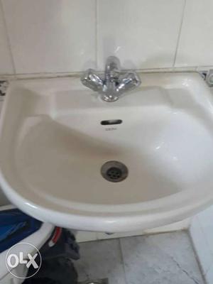 2 unused off-white Cera washbasin with tap.