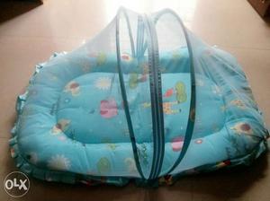 Baby bed with mosquito net. never used.