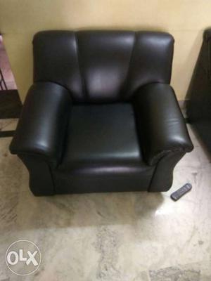 Black Leather Sofa Chair; Black Remote Control