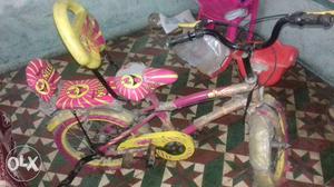 Pink And Yellow Push Bike