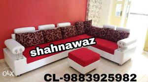 Red and white sectional couch with ottoman