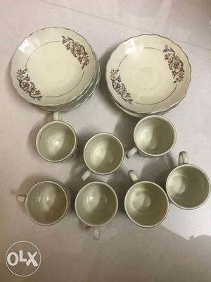 Seven White Ceramic Mugs and nine saucers