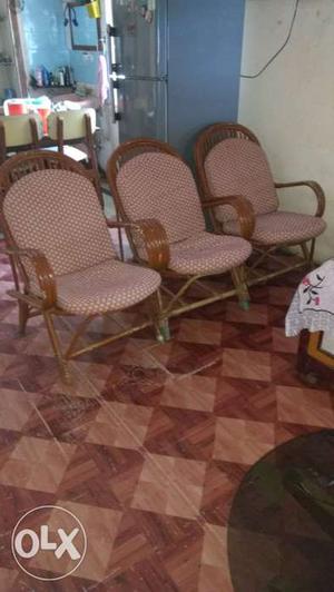 Three Brown Wooden Base Red Seat Armchairs