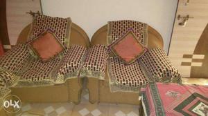 Two Brown Sofa Chairs With Cover