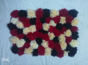 A beautiful new hand made pom pom door mat only