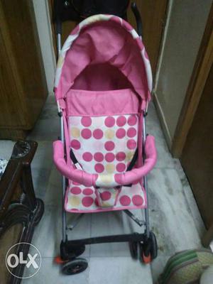 Baby's Pink And White Polka Dotted Stroller new condition