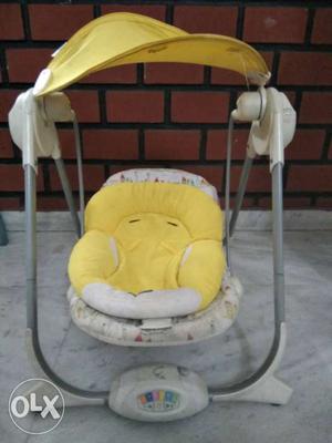 Baby's Yellow And White Swing With Canopy chicco brand