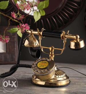 Black And Gold-colored Cradle Telephone