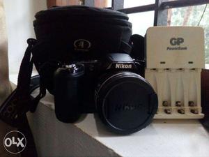 Black Nikon Coolpix L320 Camera With White Charger