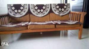 Brown Fabric Couch With Wooden Frame