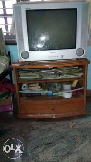 Brown Wooden Television Stand With Gray CRT Television